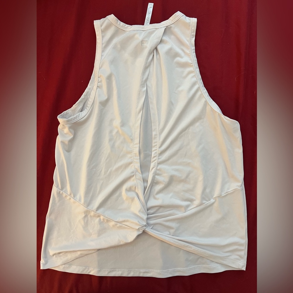 Back view of a Fabletics white tank top.